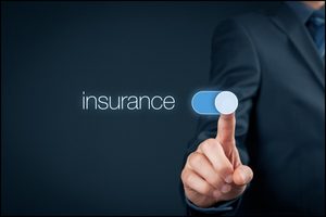 Finger switching on an insurance toggle displayed on a screen.