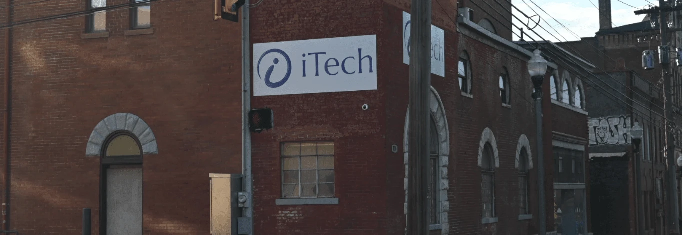 iTech representative solving server data rack issues with cybersecurity, data backup, and IT solutions.