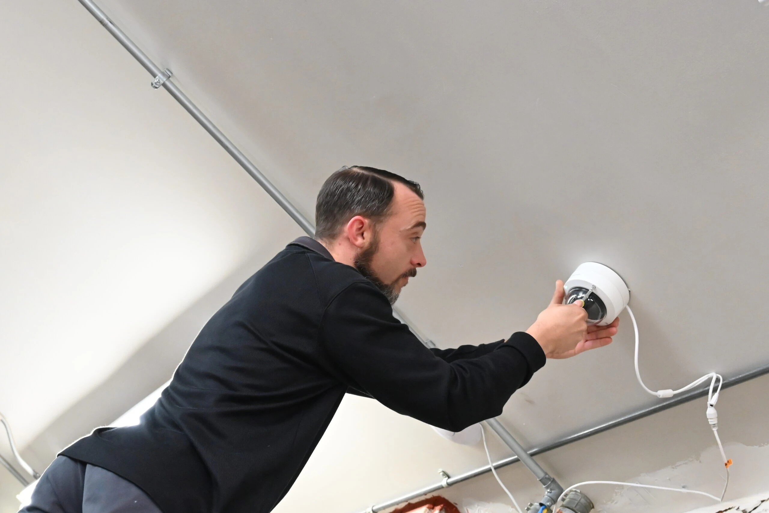 iTech Service Technician installing a dome CCTV Surveillance Camera