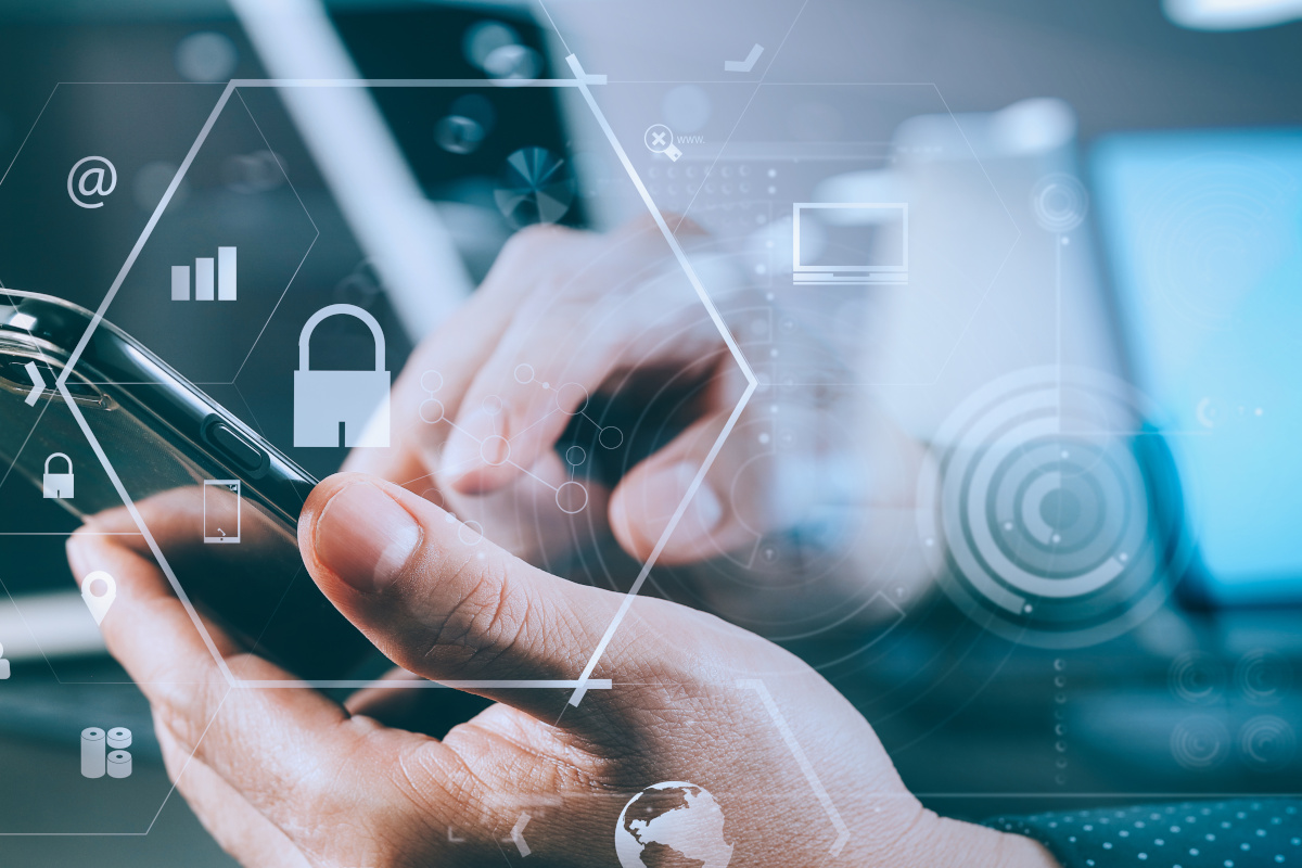 Man using mobile phone with security icons floating around