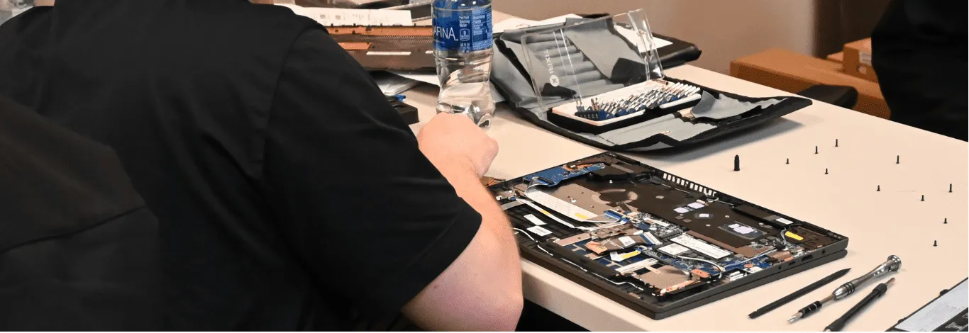 iTech representative solving server data rack issues with cybersecurity, data backup, and IT solutions.