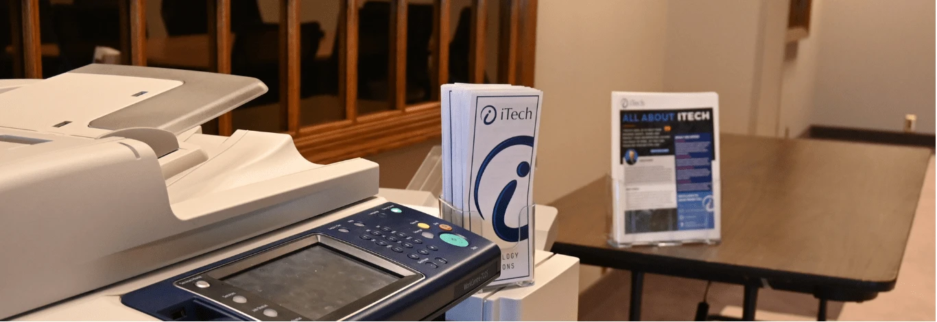 iTech support technician resolving a technical issue; professional cyber security, computer repair, and cloud backup services for businesses.